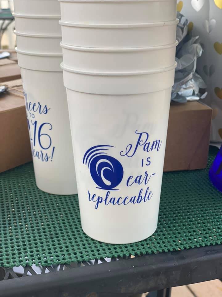 Pam is ear-replaceable written on white disposable cups